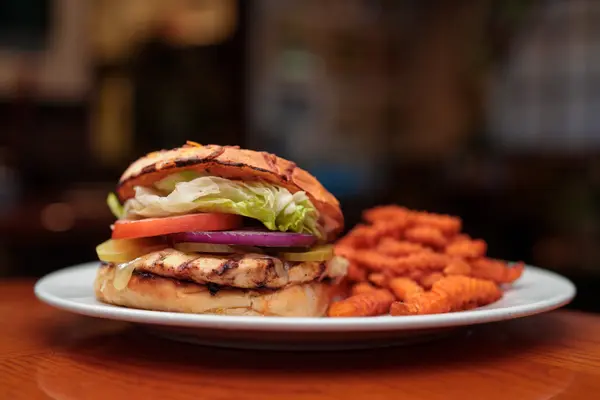 Ranch Kitchen chicken sandwich with sweet potato fries