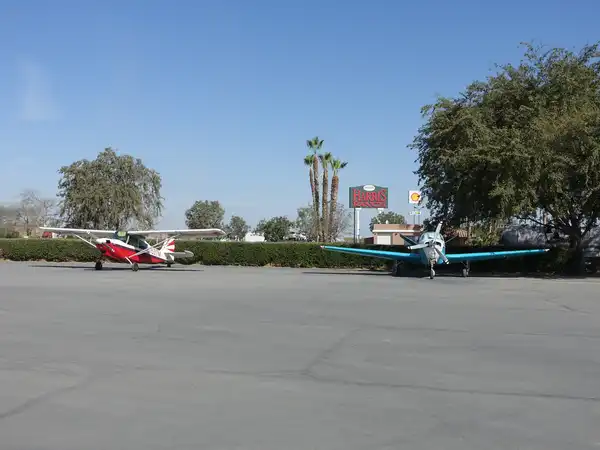 Small planes parked on the Harris Ranch Airport landing strip