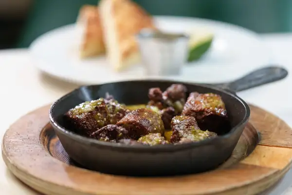 Steak bites served in a cast-iron skillet