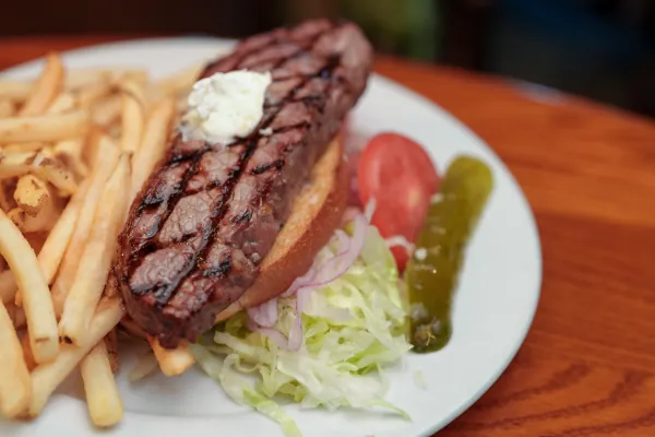 Grilled steak with fries and salad