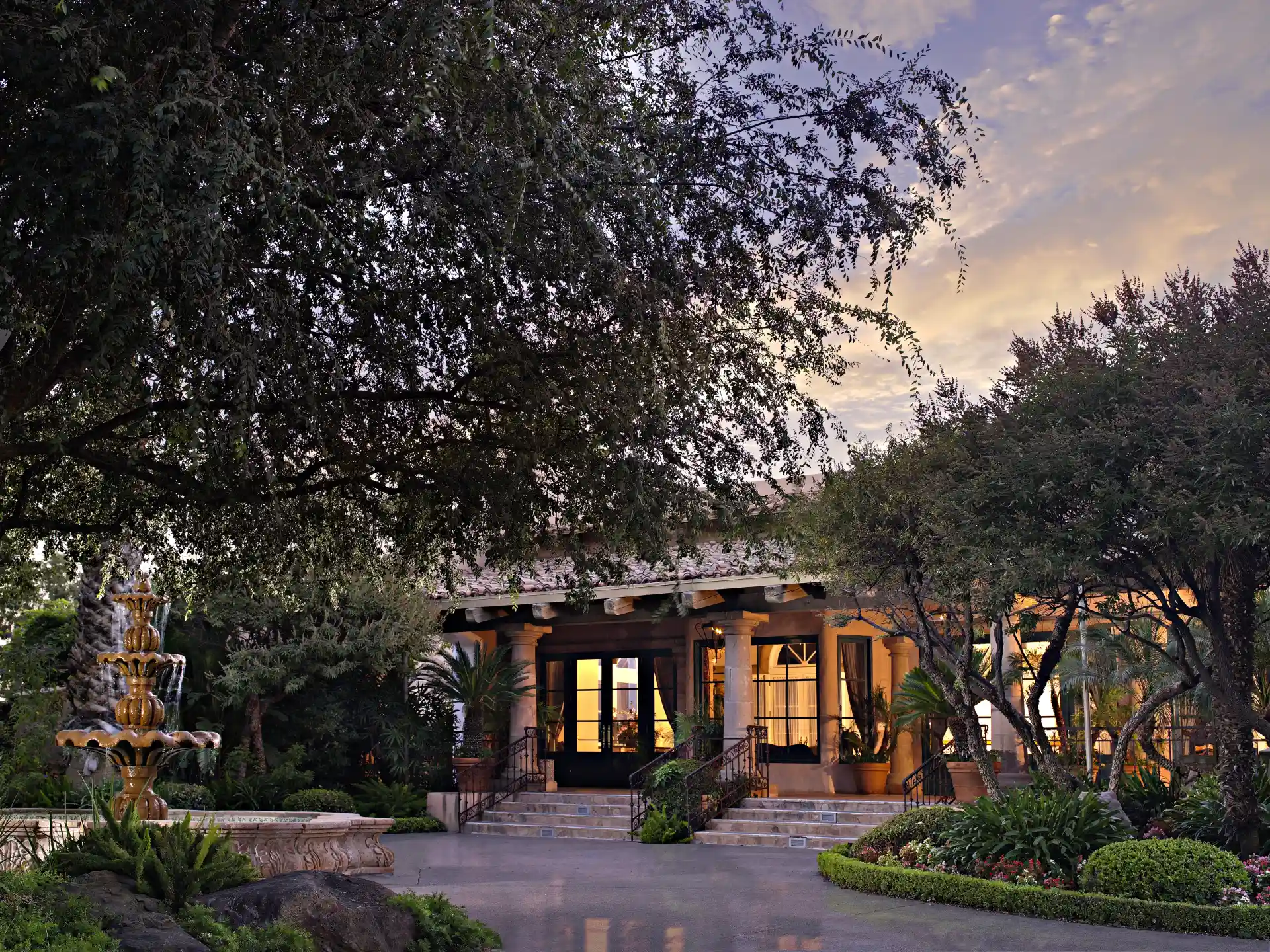 Harris Ranch Resort entrance and courtyard fountain at dusk