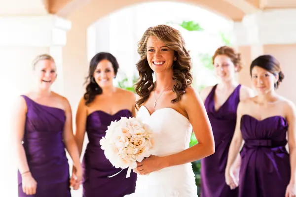 Bride with bridesmaids in purple dresses