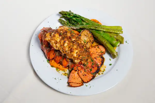 Prime Steakhouse lobster tail with asparagus